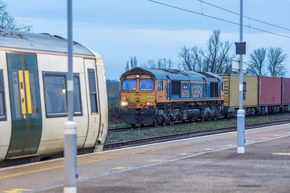 Intermodal train from Felixstowe passes a passenger train at Ely