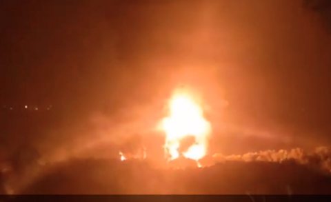 Night fire with flames rising into the sky at Llangennech in Wales after crash