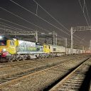 Night shot of Tarmac 'jumbo train' hauled by Freightliner