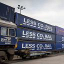 Tesco DRS containers stacked three high next to a DRS locomotive