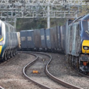 Electric goods and passenger trains pass each other
