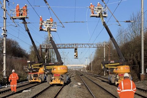 Engineers erecting electric wires over the Midland Main Line