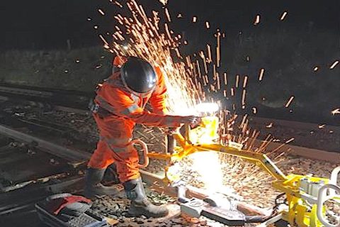 Welder at work on the railway with sparks flying