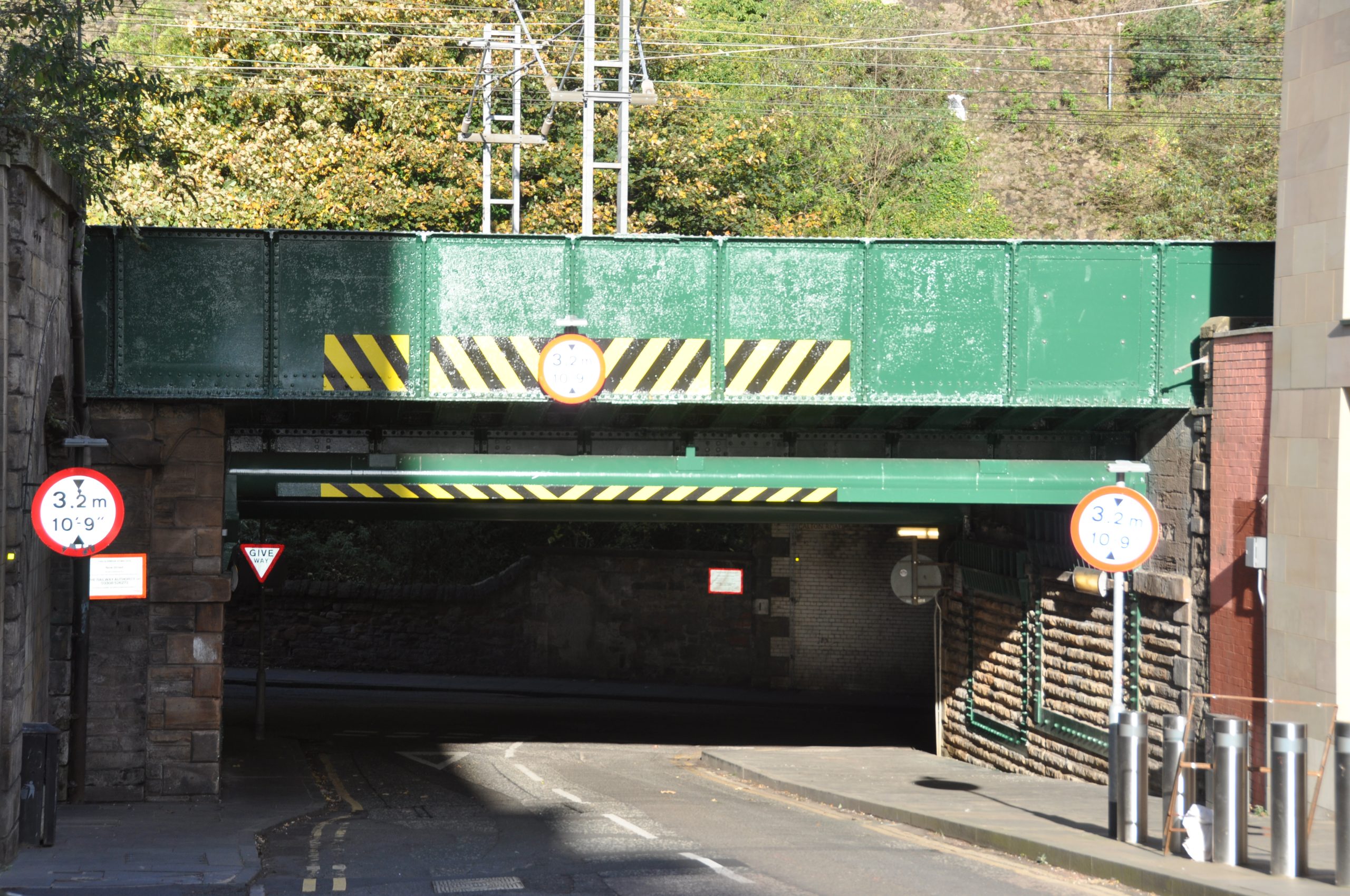 The recently renovated New Street Bridge in Edinburgh. Painted green with yellow and black warning stripes (Network Rail image)