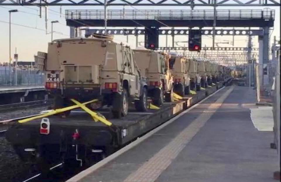 British Army vehicles on a train