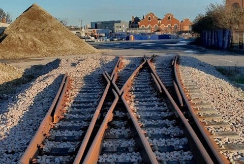 close up ground level view of tracks being laid into Plumstead Depot