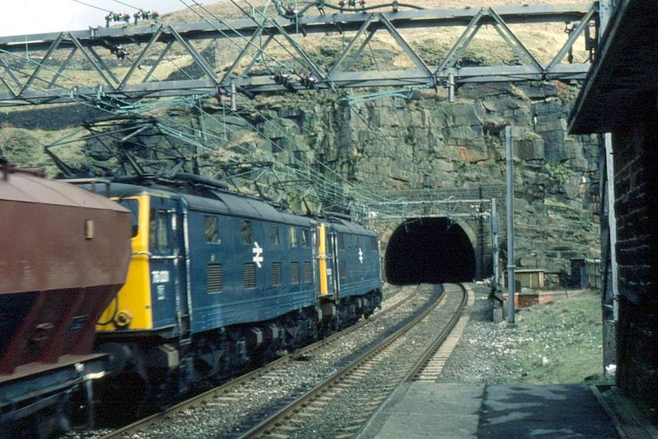 British Rail Class 76 locomotives 76033 and 76031 with a mineral train about to enter the tunnel on the Woodhead Line in 1981