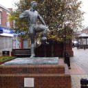 The statue of the Newcastle United and England footballer Jackie Milburn in Station Road, Ashington, Northumberland.