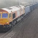 Biffa liveried class 66 operated by GB Railfreight hauls another waste train