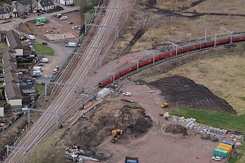 Aerial view of Royal Mail EMU passing through Carstairs Junction