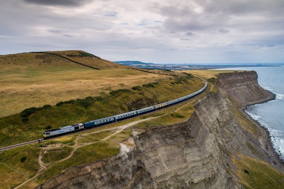 Special passenger train with thirteen carriages on the clifftop line near Boulby Mine in Yorkshire