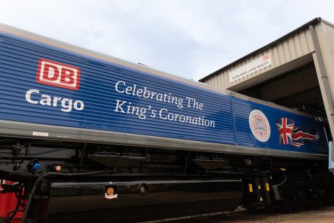 Special coronation livery on the side of a class 66 locomotive standing outside Toton Depot
