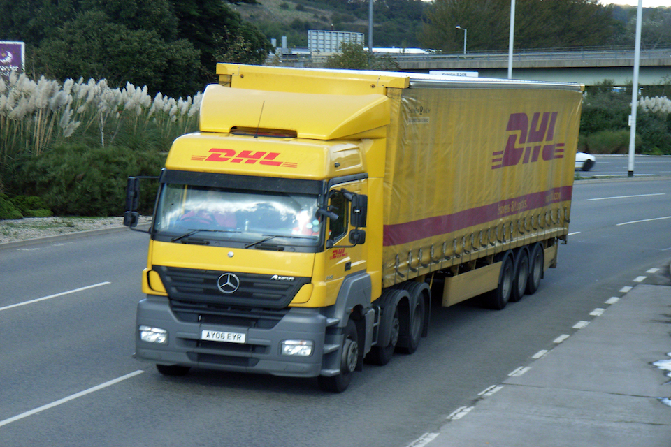 DHL liveried truck on a UK road
