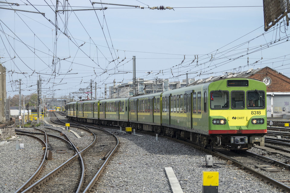 A Dublin Area Rapid Transit (DART) train approching Dublin Connolly station under extensive overhead wires
