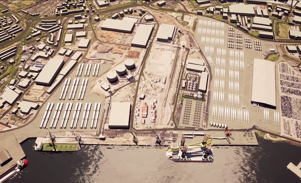 Sky shot of the Port of Tyne complex showing ships at dock, quayside, warehouses and wind farm components