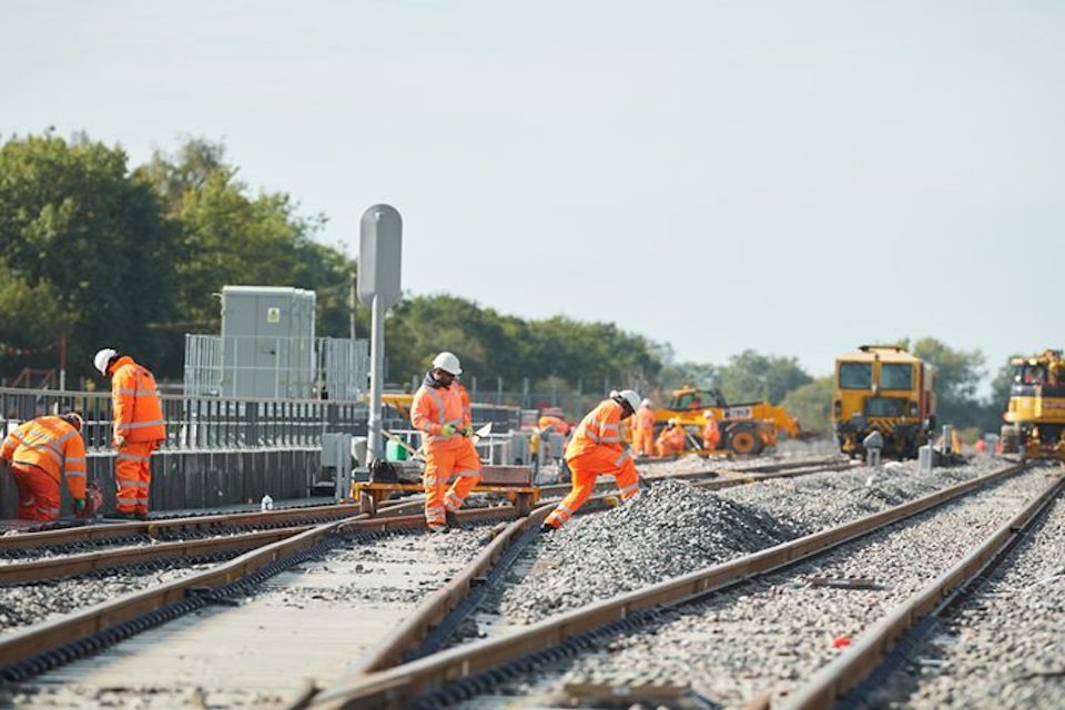 Buckingham Group workers on the tracks in their orange PPE