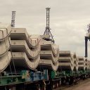 A train loaded with semi-circular concrete tunnel lining segments ready to depart for the HS2 site in London
