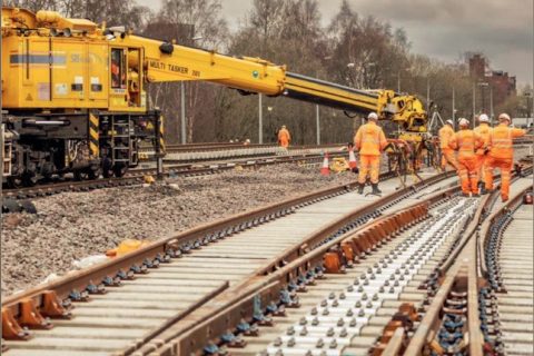 Network Rail engineers on tracks with a rail mounted crane