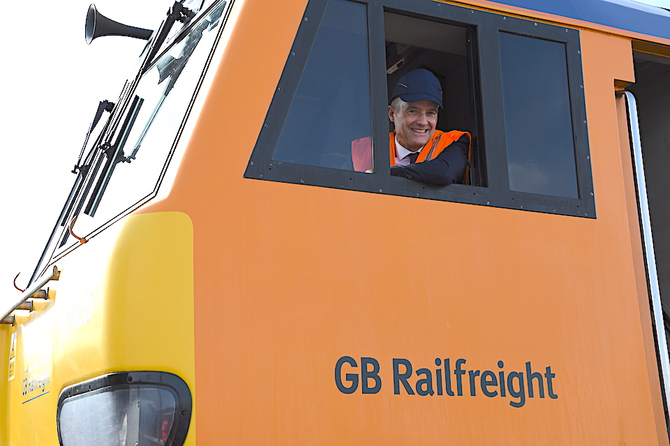 Secretary of State for Transport, Mark Harper, looking out from the cab side window of a GB Railfreight locomotive at the official opening of the company's Maintenance Hub in Peterborough on 26 September 2023 (GBRf)