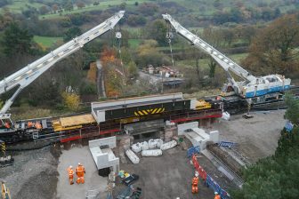 Sky shot of cranes lifting bridge into place at Bamford in the Hope Valley